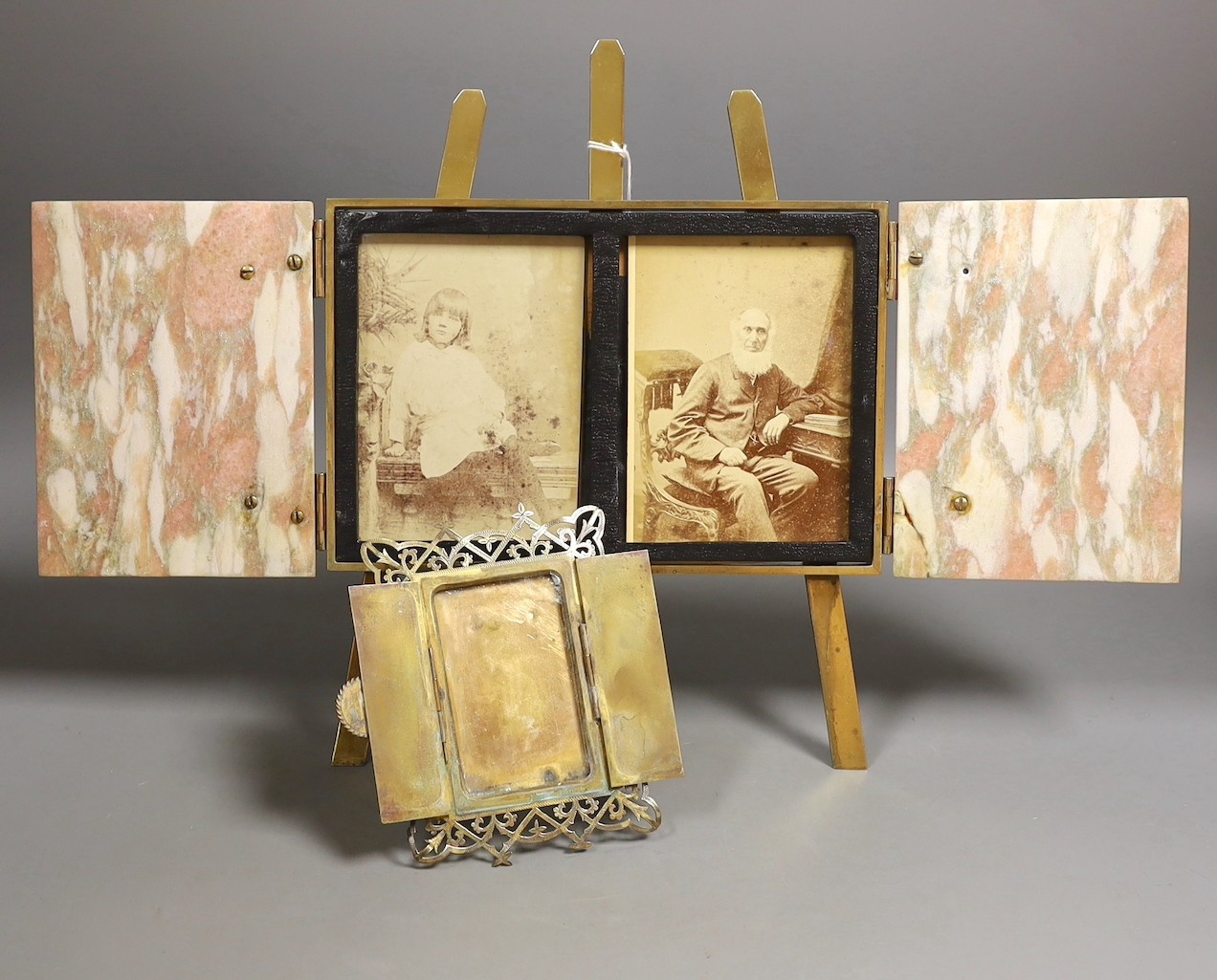 A brass and marble mounted diptych easel frame and a brass and agate mounted easel photo frame, largest, 24.5 cms wide x 32 cms high.